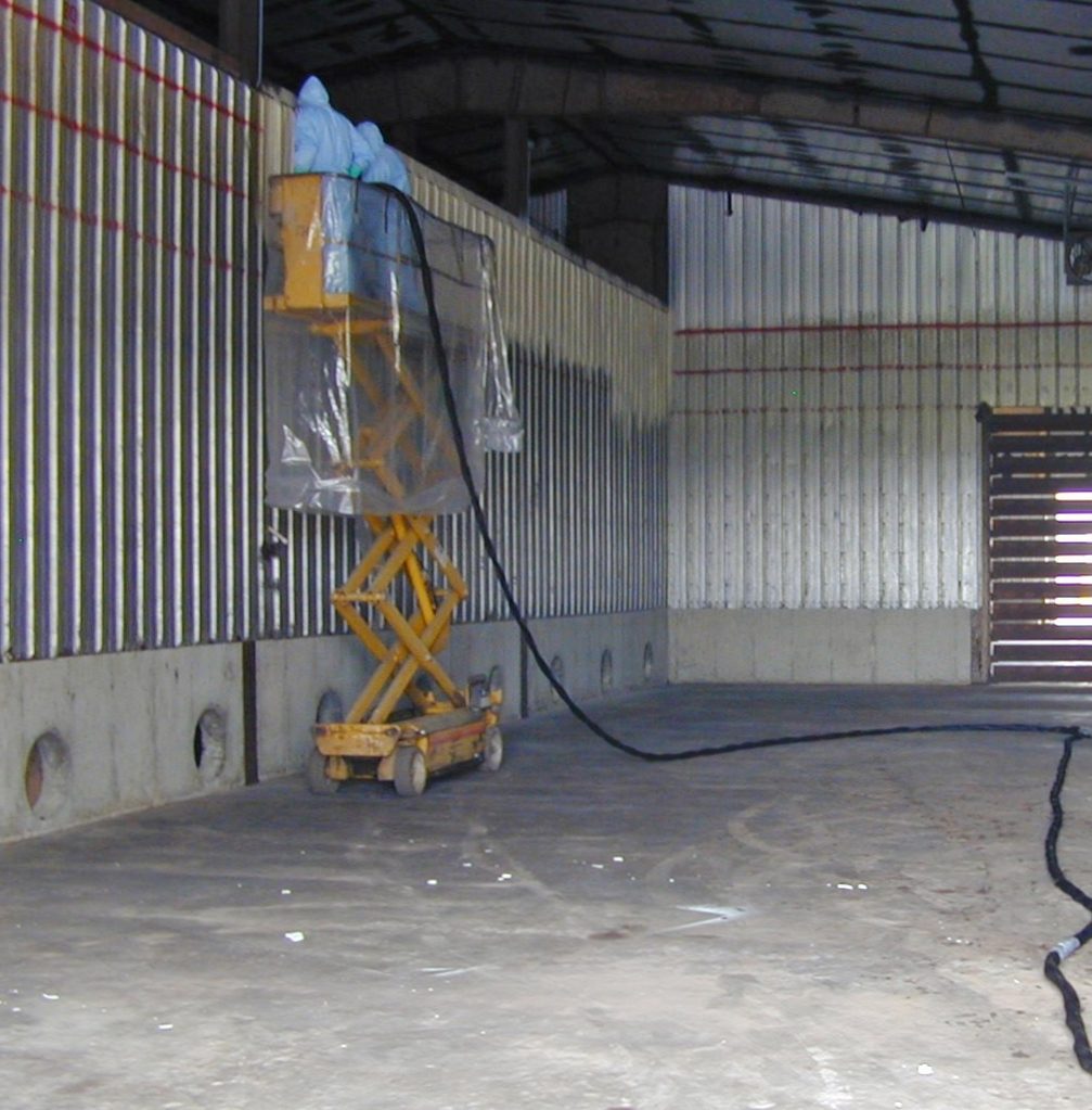 Spray foam insulation applied to the underside of a steel barn roof