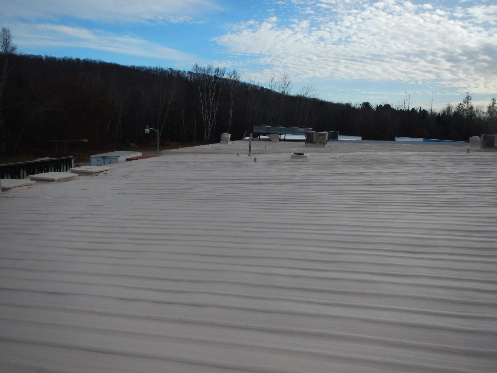 Seamless membrane over screw-down steel panels